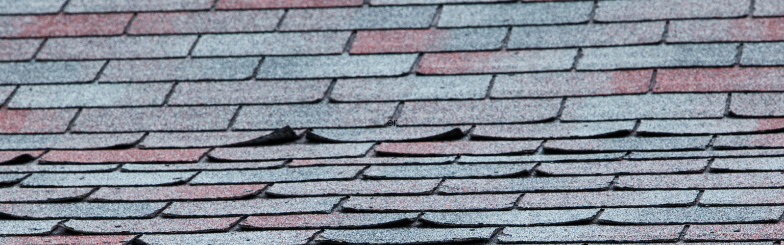 wind caused roof shingles to curl