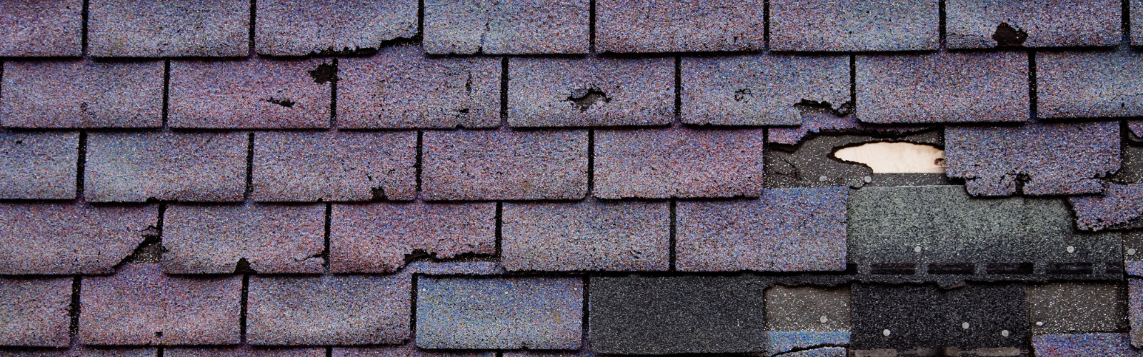 rood with missing and broken shingles