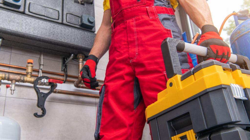 HVAC technician holding tools