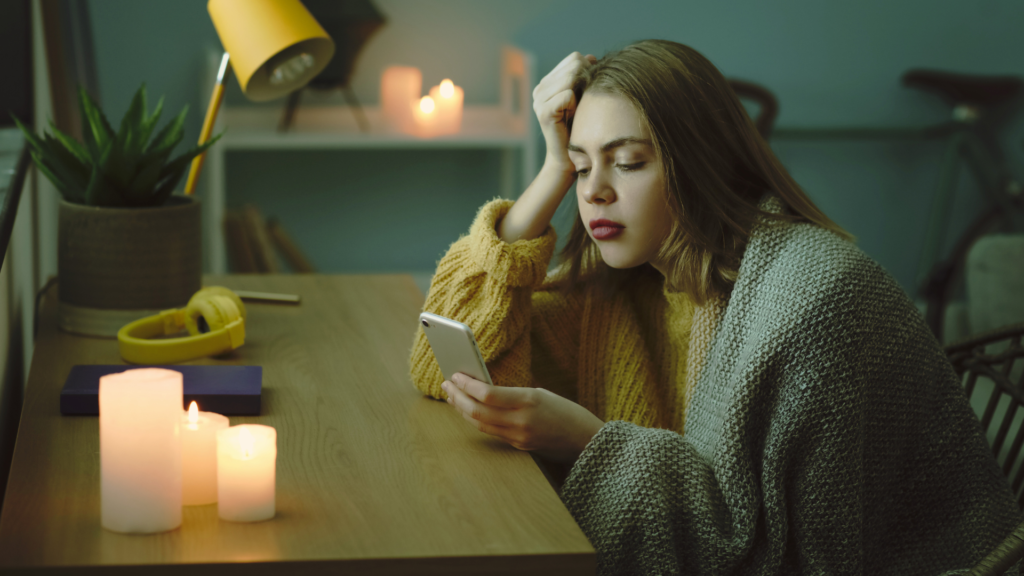 woman on her phone during blackout.png