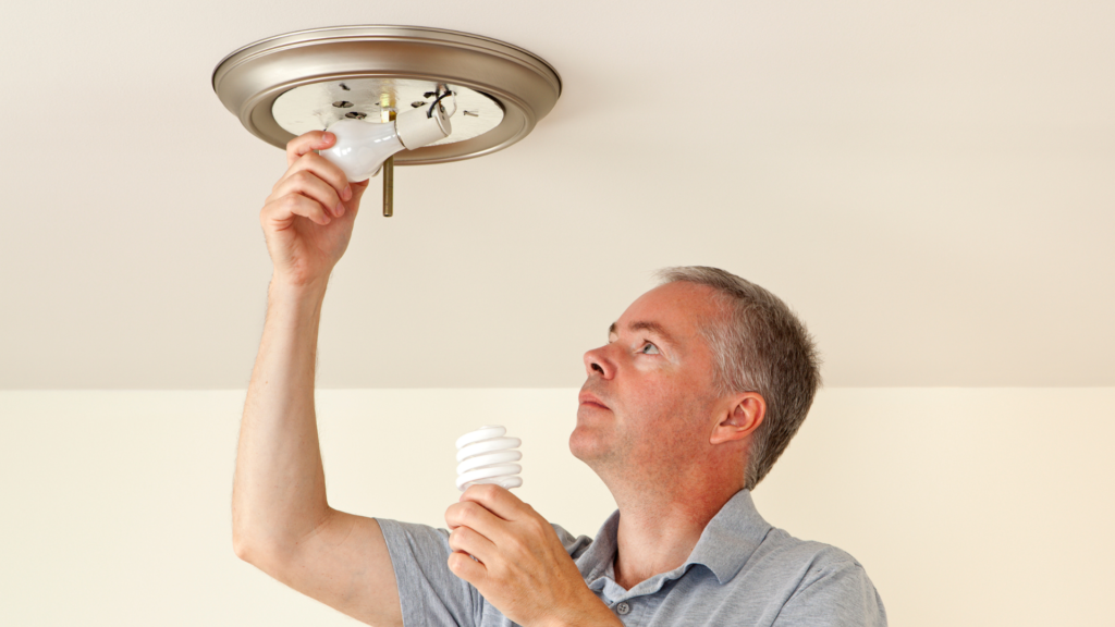 man changing lightbulb