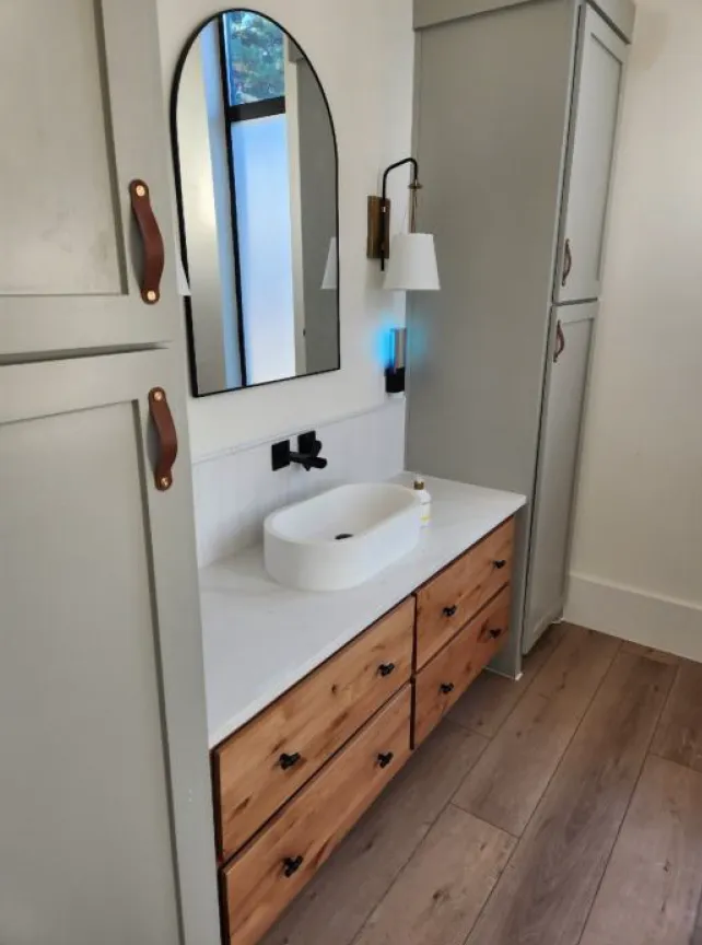 custom cabinets, plumbing, and lights for bathroom vanity