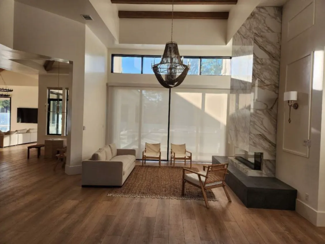 formal living room with custom fireplace